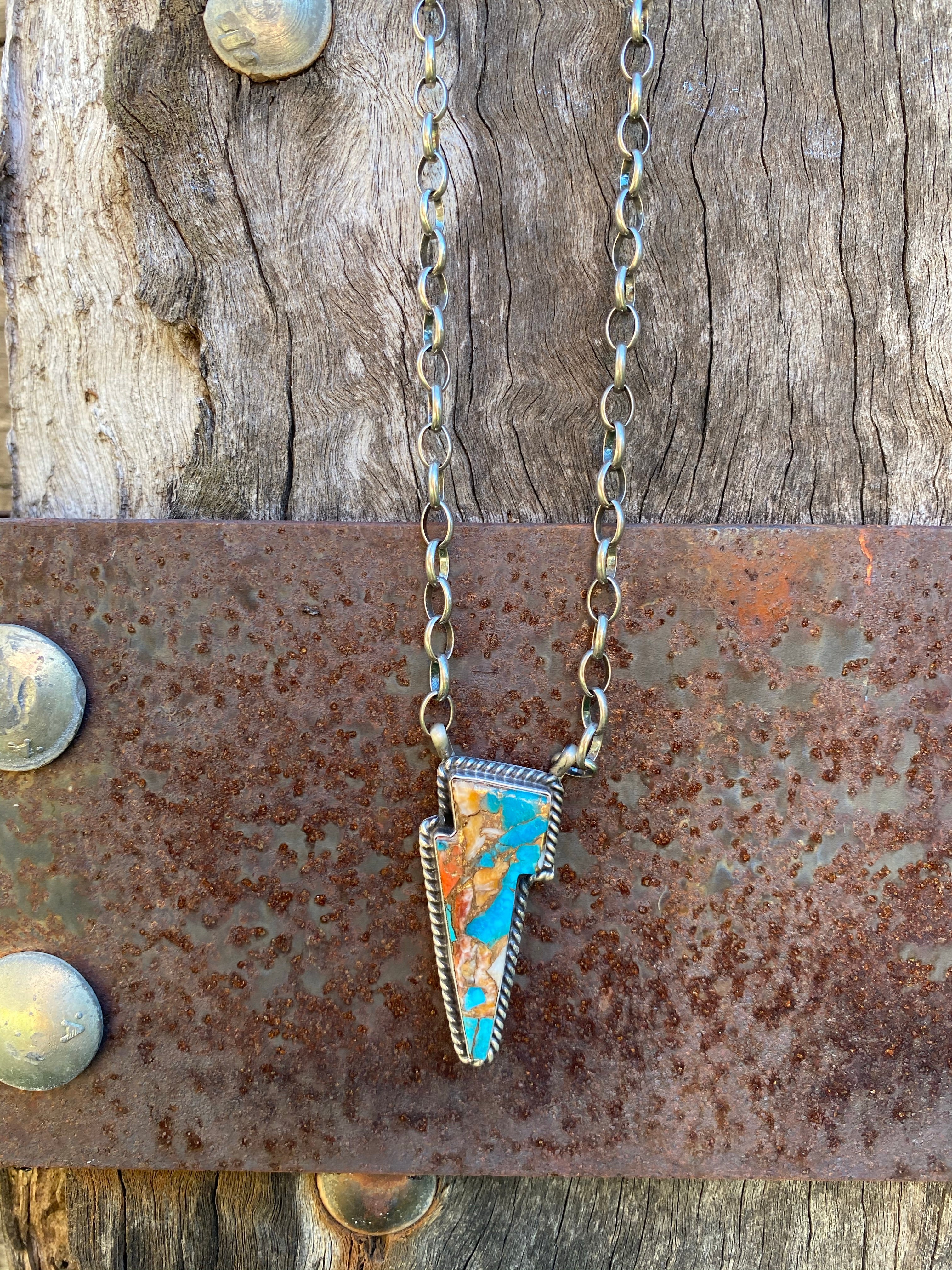 Spiny Oyster Lightning Bolt Pendant Necklace.